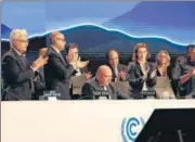  ?? REUTERS ?? Delegates applaud after COP27 president Sameh Shoukry’s statement at the closing plenary in Egypt on Sunday.
