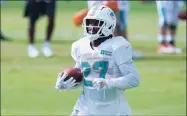  ?? Lynne Sladky / Associated Press ?? The New York Jets traded for Miami Dolphins running back Kalen Ballage for a conditiona­l seventh-round draft pick in 2021.