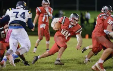  ?? GENE WALSH — DIGITAL FIRST MEDIA ?? Upper Dublin’s Mason Novak runs for yardage against Cheltenham Friday night.