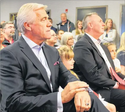  ?? DAVID MAHER/THE TELEGRAM ?? Premier Dwight Ball and Liberal candidate Paul Antle (right) await their chance to speak at Antle’s campaign launch Wednesday morning in St. John’s.
