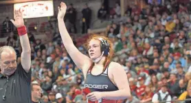  ?? ZAC BELLMAN / MILWAUKEE JOURNAL SENTINEL ?? Badger junior Ella Creighton celebrates after winning the 185-pound individual state title in the girls division of the WIAA state wrestling meet Saturday at the Kohl Center in Madison.