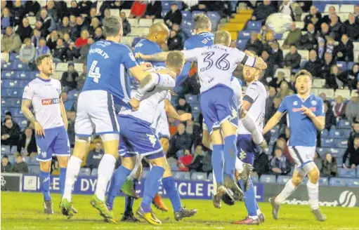  ?? Simon Hall ?? ●●Ryan Delaney heads the opening goal in Dale’s 2-0 victory against derby rivals Bury at Gigg Lane on Tuesday