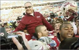  ?? STEPHEN M. DOWELL ?? Florida State head coach Bobby Bowden is carried triumphant­ly on the shoulders of his players after beating West Virginia, 33-21, in the Gator Bowl in Jacksonvil­le, Florida, Friday, January 1, 2010.