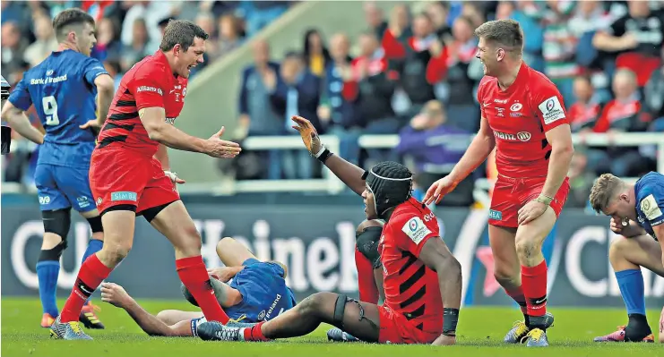  ??  ?? Fond memories: Alex Goode (left), Maro Itoje (floor) and Owen Farrell celebrate victory over Leinster in last year’s final