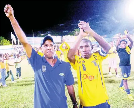  ?? FILE ?? Donovan Hayles (left) and Richard Edwards wave to to the crowd after Harbour View after winning the Premier League in 2007.