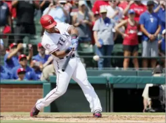  ?? TONY GUTIERREZ — THE ASSOCIATED PRESS ?? Texas Rangers’ Adrian Beltre hits a double off a pitch from Baltimore Orioles’ Wade Miley in the fourth inning Sunday to become the first player from the Dominican Republic, and the 31st player in major league history, with 3,000 career hits. The...