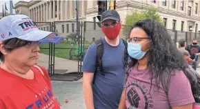  ?? RICARDO TORRES/MILWAUKEE JOURNAL SENTINEL ?? Supporters and protesters of President Donald Trump argue Tuesday before his visit to Kenosha.