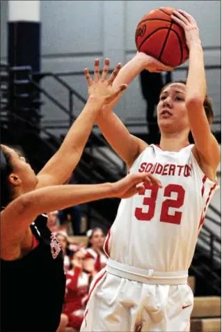  ?? BOB RAINES — DIGITAL FIRST MEDIA ?? Souderton’s Kate Connolly lofts a shot over Coatesvill­e’s Brianna White during their game on March 3, 2017.