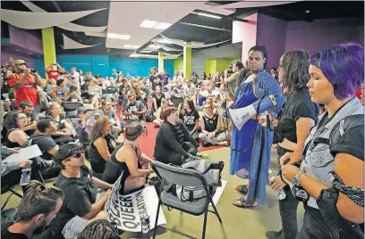  ?? [TOM DODGE/DISPATCH] ?? Wriply Bennet, dressed in blue, and other members and supporters of the group nicknamed the #BlackPride­4 dominated the community conversati­on Monday night at the Northland Performing Arts Complex.