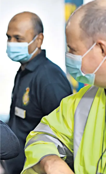  ?? ?? Boris Johnson offers an elbow bump greeting during a visit to the headquarte­rs of the London Ambulance Service NHS Trust in July 2020