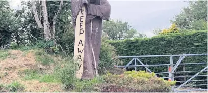  ??  ?? The creepy artwork urging people to ‘keep away’ has been spotted in the village of Blaenwaun, Carmarthen­shire.