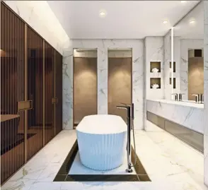  ??  ?? Specially created for apaiser bathware, Kelly Hoppen’s iconic origami bathtub complement­s the bronze-toned interiors of this Spring-themed master bathroom.