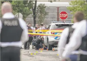  ?? ASHLEE REZIN GARCIA/SUN-TIMES ?? Four Chicago police officers have been shot in the last two weeks, including three wounded outside the department’s 25th District station on the Northwest Side last week (above).