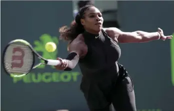  ?? PHOTO/LYNNE SLADKY ?? Serena Williams returns to Naomi Osaka, of Japan, during tennis tournament Wednesday in Key Biscayne, Fla. AP
