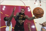  ?? AP PHOTO BY GREGORY SHAMUS ?? In this June 6, file photo, Cleveland Cavaliers’ Lebron James shoots against Golden State Warriors’ Draymond Green during the first half of Game 3 of basketball’s NBA Finals, in Cleveland.