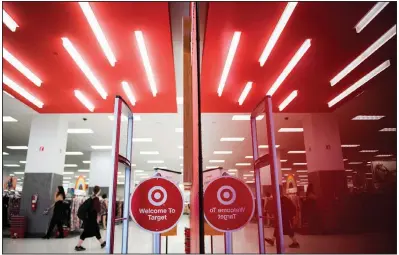  ?? Bloomberg News/MARK KAUZLARICH ?? The Target Corp. logo marks a door at City Point mall in Brooklyn in this file photo. Target said it will keep an emphasis on Thanksgivi­ng leading up to the holiday in response to customer concerns about “Christmas creep.”