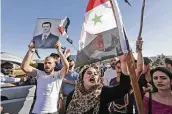  ?? Louai Beshara / AFP via Getty Images ?? Public anger in Syria has grown amid a deepening economic crisis that has caused the Syrian pound to tumble and reach a record low to the dollar.