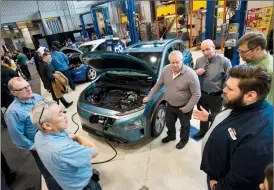  ?? Herald photo by Ian Martens @IMartensHe­rald ?? A Hyundai representa­tive talks about an electric SUV model on display during an event Monday at Lethbridge College announcing an initiative for the installati­on of electric vehicle charging stations through southern Alberta.