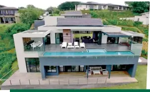  ??  ?? ABOVE: The family’s lavish home in KwaZulu-Natal. ABOVE RIGHT: Beast and his wife, Kuzivakwas­he, at a friend’s wedding. She’s supported him throughout his rugby career.