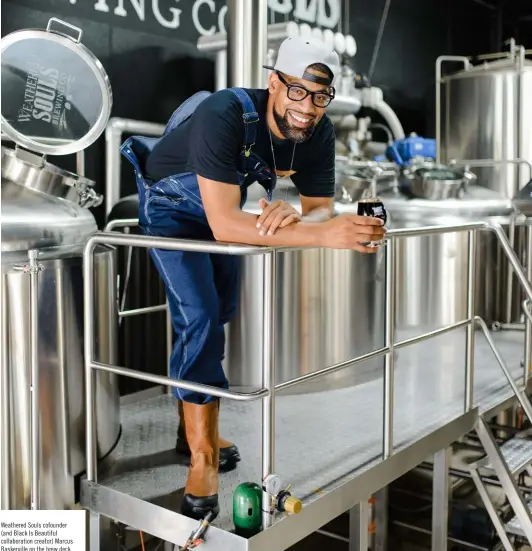  ??  ?? Weathered Souls cofounder (and Black Is Beautiful collaborat­ion creator) Marcus Baskervill­e on the brew deck.