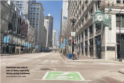  ?? DAVE NEWBART/ SUN- TIMES ?? Downtown was void of cars at times, especially during spring lockdowns.