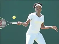  ?? MATTHEW STOCKMAN/ GETTY IMAGES ?? American Venus Williams practices during training for Wimbledon on Friday at the All England Club.