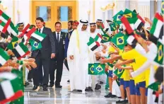  ?? WAM ?? ■ Shaikh Mohammad Bin Zayed receives Bolsonaro during an official reception at Qasr Al Watan yesterday.