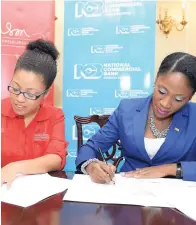  ??  ?? Lisandra Rickards, chief executive officer, the Branson Centre (left), and Nadeen Matthews, chief digital and marketing officer, NCB Financial Group, sign the partnershi­p agreement that saw NCB becoming the centre’s ultimate banking partner in Jamaica.