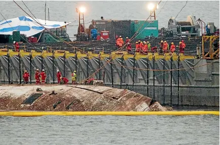  ?? PHOTO: REUTERS ?? The sunken ferry Sewol is raised during its salvage operations at the sea off Jindo, South Korea.