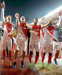  ?? — AFP ?? Monaco players celebrate their 3-1 win over Manchester City in their Champions League Round of 16 second leg match at the Stade Louis II in Monaco on Wednesday.