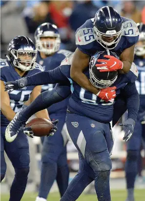  ?? AP Photo/Mark Zaleski ?? ■ Tennessee Titans inside linebacker Jayon Brown (55) and defensive end Jurrell Casey (99) celebrate a sack against Jacksonvil­le Jaguars quarterbac­k Cody Kessler (6) during the second half of an NFL football game Dec. 6 in Nashville, Tenn.