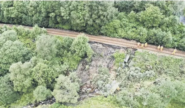  ??  ?? 0 Network Rail said the steep slopes would be a challenge to rebuilding the line near Crianlaric­h which was undermined by heavy rain washing away foundation­s