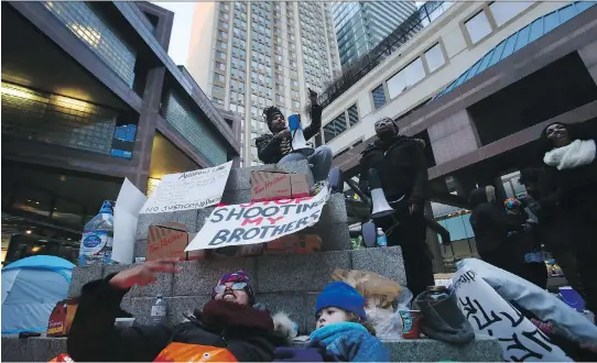  ?? COLE BURSTON/THE CANADIAN PRESS FILES ?? A group of Black Lives Matter protesters chant outside Toronto Police headquarte­rs on March 21. They were angry when the Special Investigat­ions Unit cleared a Toronto police officer of any wrongdoing in the shooting death of 45-year-old Andrew Loku...