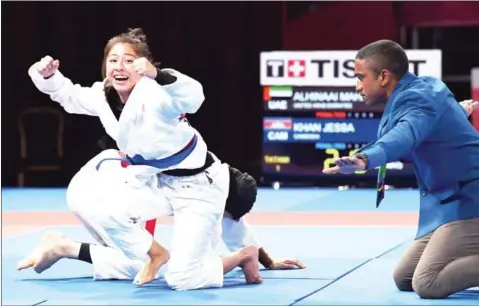  ?? GOH CHAI HIN/AFP ?? Jessa Khan of Cambodia celebrates after beating Mahra Alhinaai of United Arab Emirates in the women’s under-49kg ju-jitsu finals at the 2018 Asian Games in Jakarta on Friday.