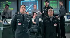  ??  ?? John Cena as Agent Burns and John Ortiz as Dr. Powell in Bumblebee