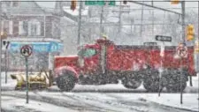  ?? KYLE FRANKO — TRENTONIAN PHOTO ?? A snow plow clears the road on the northbound side of Route 29 in Trenton during a snowstorm on Wednesday afternoon.