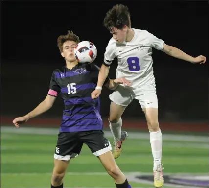  ?? KEN SWART — FOR MEDIANEWS GROUP ?? Pontiac’s Brandon Preciado-Hernandez (8) goes airborne for the ball against Bloomfield Hills’ Marc Ventura (15) during the OAA Blue match played on Monday at Bloomfield Hills High School. The Phoenix lost to the Black Hawks 1-0.