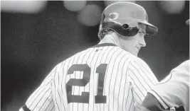  ?? DAVID LEEDS/GETTY ?? Paul O’Neill stands on a base as he looks on during a game between the Yankees and Royals on April 16, 2000, at Yankee Stadium.