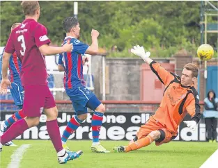  ??  ?? ■
Ian Vigurs notches Inverness’s fifth, just after the break.