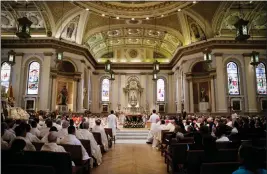  ?? ?? Clergy, family and community members participat­e in the funeral Mass.