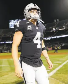  ?? Scott Strazzante / The Chronicle ?? Derek Carr threw three intercepti­ons and found Amari Cooper only once in Monday’s season-opening loss.