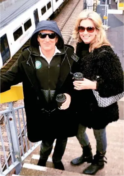  ??  ?? Downtown Train: Rod Stewart and Penny Lancaster start their journey to the O2 yesterday