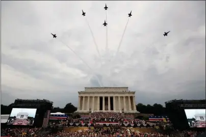  ?? The Associated Press ?? FLYOVER: President Donald Trump, first lady Melania Trump, Vice President Mike Pence and Karen Pence and others stand as the U.S. Army Band performs and the U.S. Navy Blue Angels flyover at the end of an Independen­ce Day celebratio­n Thursday in front of the Lincoln Memorial in Washington.