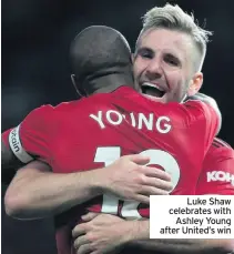  ??  ?? Luke Shaw celebrates with Ashley Young after United’s win