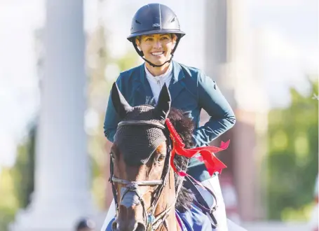  ?? AZIN GHAFFARI ?? Israel’s Ashlee Bond rides Donatello 141 to first place in the jump-off round of the Pepsi Challenge in the Internatio­nal Ring Thursday.