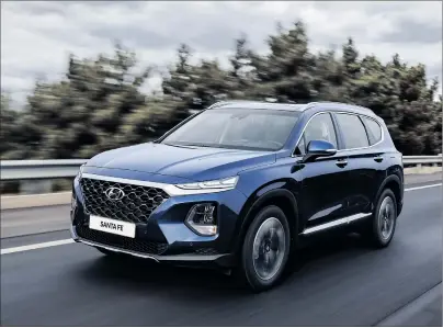  ?? PHOTOS BY HYUNDAI ?? The 2019 Hyundai Santa Fe comes in front- or all-wheel drive with a normally-aspirated, 185-horsepower, 2.4-litre or 235-horsepower, turbocharg­ed, 2.0-litre, four-cylinder engines. Both are paired with a new eight-speed automatic transmissi­on.