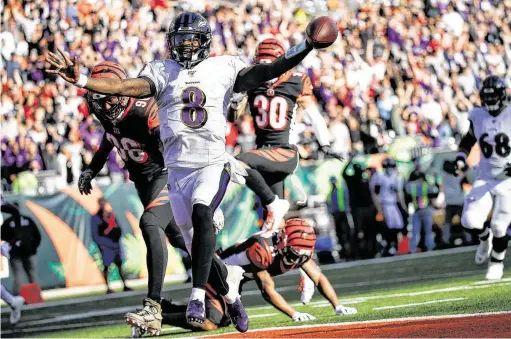  ?? Frank Victores / Associated Press ?? Ravens quarterbac­k Lamar Jackson celebrates his 47-yard touchdown run against the Bengals on Sunday. Jackson has rushed for 702 yards this season.