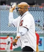  ?? Andrew Harnik The Associated Press ?? U.S. Rep. John Lewis, D-GA., throws out the ceremonial first pitch for Jackie Robinson Day before a game Sunday between the Colorado Rockies and Washington Nationals.