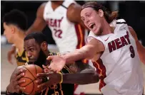  ?? MARK J. TERRILL THE ASSOCIATED PRESS FILE PHOTO ?? Los Angeles Lakers' LeBron James controls a rebound in front of Miami's Kelly Olynyk (9) in Game 2 of the NBA finals.