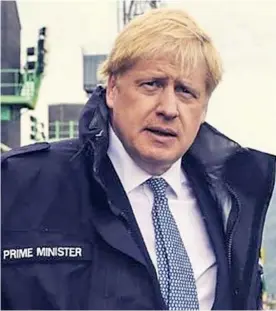  ??  ?? Defiant Boris Johnson visiting a naval base on the Clyde yesterday